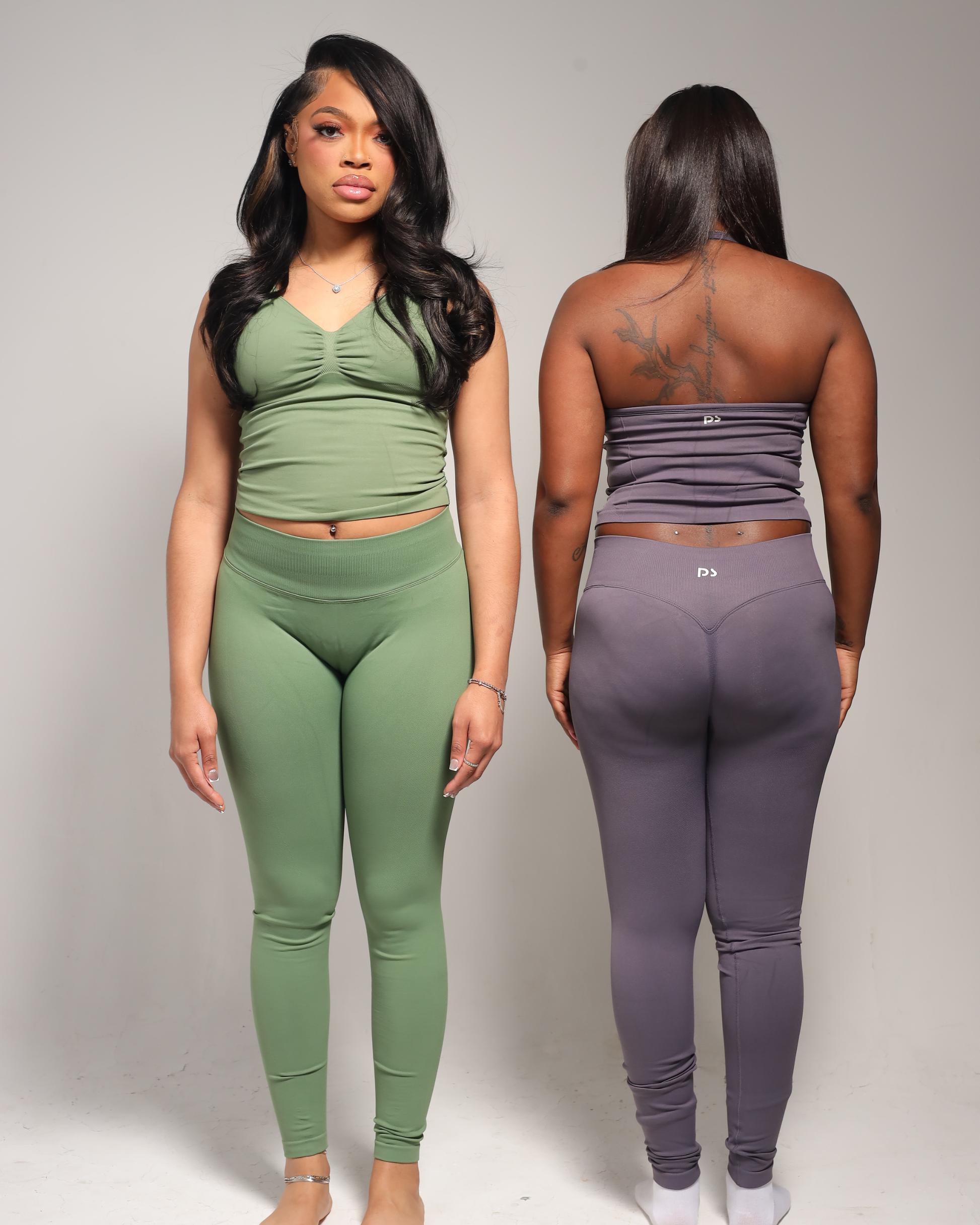 Two women wearing matching outfit